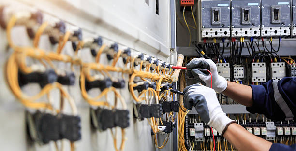 Professional Electrician technician working in McDade, TX